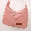 Detailed view of pink corduroy shoulder bag featuring zip pockets and fashion leather patch - One Size / Pink