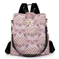 Women's vintage wave pattern backpack with a gold bow accent and dual shoulder straps - Pink
