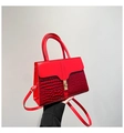 Detail of red stone pattern patchwork handbag with gold metal twist lock and dual handles - Red