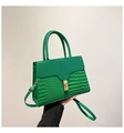 Close-up of green stone pattern crossbody bag with golden metal twist lock and strap - Green