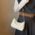 Chic cream white underarm bag with silver chain strap and shiny faux leather finish - White
