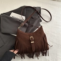 Dark brown faux suede crossbody bag with fringe tassel detail and metallic buckle - Brown