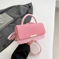 Pink crossbody bag with textured woven flap and adjustable strap for women - Pink