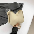 Creamy beige faux leather hobo bucket bag with gold fashion metal buckle detail - Off White