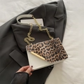 Fashionable leopard print flap crossbody bag with white leather base and gold chain strap - White