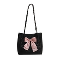 Large black velvet tote bag featuring a prominent pink satin bow and woven straps - Black