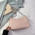 Pale pink underarm bag with woven texture and silver chain strap for women - Pink