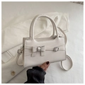 White minimalist square handbag with leather bow detail and adjustable shoulder strap - White