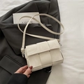 Minimalist cream woven crossbody bag with wide texture and slim leather strap - White