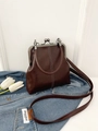 Retro dark brown leather handbag with metal frame closure and stylish white stitching - Dark Brown