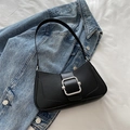 Chic black underarm bag in faux leather with a vintage silver buckle design - Black