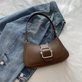Chic coffee brown faux leather underarm bag with silver buckle on blue denim jacket - Brown