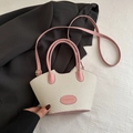 Bolso estilo cubo tejido en rosa y blanco con asas de cuero y correa de hombro - Rosa