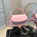 Pink PU leather saddle bag with sparkling sequin finish and fashion branding - Pink