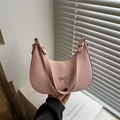 Pink crescent moon underarm bag with matte finish and elegant silver bow charm - Pink