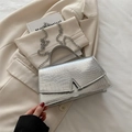 Silver crocodile embossed leather handbag with metal V-buckle and chain strap - Silver