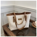 Fashionable straw tote bag with woven herringbone pattern and brown leather handles - Brown