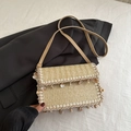 Bohemian woven straw crossbody bag with natural shells and delicate lace trim - Khaki