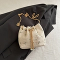 Straw woven bucket bag in cream white with floral embroidery and gold chain strap - White