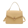 Chic light yellow leather handbag with gold metal ring clasp and top handle - Yellow