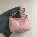 Pink minimalist nylon dumpling bag with adjustable shoulder strap and side pockets - Pink