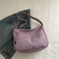 Lilac hobo canvas crossbody bag featuring adjustable strap and front pockets in casual style - Purple