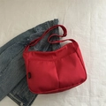 Minimalist red nylon crossbody bag with double front pockets and adjustable strap - Red
