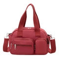 Versatile red nylon handbag with crossbody strap and multi-pocket functional design - Red