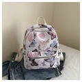 Witte casual rugzak met paarse en roze vlinderprints op een blauw spijkerjack - Bloem Vlinder