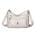 Cream soft faux leather crossbody bag with lychee texture and multiple zip pockets - Off White
