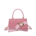 Pink patchwork crossbody bag with textured flap, golden buckle and curved top handle - Pink