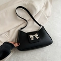 Minimalist black faux leather underarm bag with silver bow accent and slim strap - Black