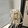 White pebbled leather crossbody bag with tassel fringe and black metal rivet accents - White