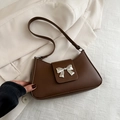 Dark brown leather baguette bag with a silver metallic bow buckle detail for women - Brown