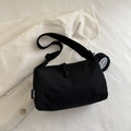 Minimalist black nylon crossbody bag with matching circular mini pouch and brand tag - Black