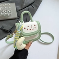 Mint green cartoon crossbody bag with cherry print and yellow moon plush charm - Green with Charm