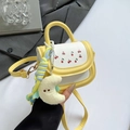 Chic cartoon girl's crossbody bag with cherry prints and a plush moon pendant accessory - Yellow with Pendant