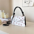 Elegant white leather cherry print crossbody bag with black knotted handles for women - Black