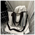 Striped canvas tote bag with adjustable shoulder strap inside a silver metal trolley - Gray