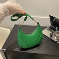 Green crescent shoulder bag with pleated leather texture and gold hardware detail - Green