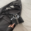 Glossy black bucket bag with pearl chain drawstring detail and adjustable strap - Black