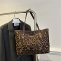 Large leopard print tote bag with brown leather handles and golden rivet details - Khaki
