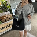 Minimalist black canvas tote bag with white graphic print and spacious Hobo design - Black
