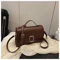 Deep brown faux leather crossbody bag with silver buckle on minimalist cream fabric - Brown