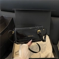 Vintage glossy black patent leather baguette bag with gold logo in premium packaging - Black