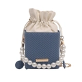 Blue woven mini bucket bag featuring a pearl handle and creamy white leather drawstring - Blue