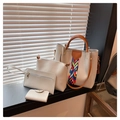 Detail of 4-piece cream white PU leather handbag set with geometric woven strap on window sill - Blue