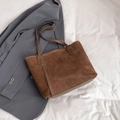 Brown suede minimalist tote bag with leather straps on a stylish professional background - Brown