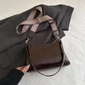 Deep chocolate brown baguette underarm bag with chic jacquard strap on a gray blazer - Dark Brown