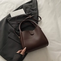 Minimalist dark coffee bucket bag with dual handles and adjustable shoulder strap - Brown